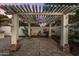 Covered patio with pergola, fountain, and string lights at 8951 E Wethersfield Rd, Scottsdale, AZ 85260