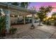 Pergola-covered patio with string lights and plants at 8951 E Wethersfield Rd, Scottsdale, AZ 85260