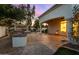 Outdoor kitchen and patio area with pergola at 8951 E Wethersfield Rd, Scottsdale, AZ 85260