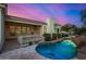 Tranquil pool area with waterfall and flagstone decking at 8951 E Wethersfield Rd, Scottsdale, AZ 85260