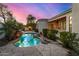 Stunning pool and spa with waterfall and flagstone decking at 8951 E Wethersfield Rd, Scottsdale, AZ 85260