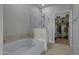 Bathroom with soaking tub, glass shower, and linen closet at 945 E Playa Del Norte Dr # 1014, Tempe, AZ 85288