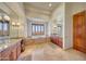 Elegant bathroom with a large soaking tub, double vanity, and stunning views at 9624 N Copper Ridge Trl, Fountain Hills, AZ 85268