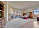 Main bedroom suite with fireplace, built-ins, and expansive views at 9624 N Copper Ridge Trl, Fountain Hills, AZ 85268