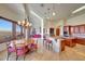 Bright dining area features a round table and chairs, plus kitchen views at 9624 N Copper Ridge Trl, Fountain Hills, AZ 85268