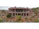 Back view of a luxury home with tiered decks and a water feature at 9624 N Copper Ridge Trl, Fountain Hills, AZ 85268