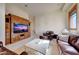 Relaxing sitting area with leather furniture and a built-in entertainment center at 9624 N Copper Ridge Trl, Fountain Hills, AZ 85268