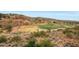 Panoramic view of a golf course and surrounding desert landscape at 9624 N Copper Ridge Trl, Fountain Hills, AZ 85268