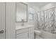 Clean bathroom with a white vanity, shower/tub, and marble-patterned curtain at 9835 E Stratus Ave, Mesa, AZ 85212