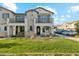 Two-story townhome with modern facade, landscaped lawn, and two-car driveway at 9835 E Stratus Ave, Mesa, AZ 85212