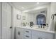 Modern bathroom with double vanity, quartz countertops, and a large mirror at 10410 N Cave Creek Rd # 1220, Phoenix, AZ 85020