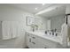 Modern bathroom with white cabinets and quartz countertop at 10410 N Cave Creek Rd # 1220, Phoenix, AZ 85020