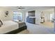 Main bedroom featuring a king bed, ceiling fan, and ensuite access at 10410 N Cave Creek Rd # 1220, Phoenix, AZ 85020