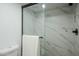 Bright and airy shower with marble tile and glass enclosure at 10410 N Cave Creek Rd # 1220, Phoenix, AZ 85020