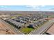 Aerial view of a new community with numerous homes and green spaces at 11435 E Utah Ave, Mesa, AZ 85212