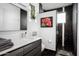 Contemporary bathroom with dark tile, a floating vanity, and a walk-in shower at 11541 E Salero Dr, Scottsdale, AZ 85262