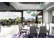 Modern dining room with glass table and chairs, mountain views at 11541 E Salero Dr, Scottsdale, AZ 85262