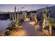 Modern entryway with desert landscaping and lighting at 11541 E Salero Dr, Scottsdale, AZ 85262