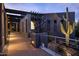 Modern entry with metal sculpture and desert plants at 11541 E Salero Dr, Scottsdale, AZ 85262