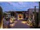 Desert contemporary home with landscaped walkway and lighting at 11541 E Salero Dr, Scottsdale, AZ 85262