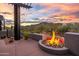 Round fire pit on patio with mountain views at 11541 E Salero Dr, Scottsdale, AZ 85262