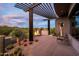 Desert landscaping with fire pit and modern pergola at 11541 E Salero Dr, Scottsdale, AZ 85262