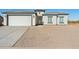 New single-story home with a two-car garage and gravel landscaping at 12360 W Delwood Dr, Arizona City, AZ 85123