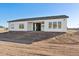 House exterior back view, showing patio and yard at 12360 W Delwood Dr, Arizona City, AZ 85123