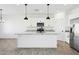 Modern kitchen with white shaker cabinets, granite countertops and island at 12360 W Delwood Dr, Arizona City, AZ 85123