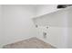 Laundry room with wood-look flooring and shelving at 12360 W Delwood Dr, Arizona City, AZ 85123