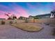 Large backyard with fire pit and string lights at 12409 W Montebello Ave, Litchfield Park, AZ 85340