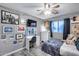 Bright bedroom featuring a desk, dresser, and art on the walls at 12409 W Montebello Ave, Litchfield Park, AZ 85340