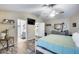 Main bedroom with ensuite bathroom, walk-in closet, and wood-look floors at 12409 W Montebello Ave, Litchfield Park, AZ 85340