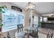 Bright dining area with glass table and window seat at 12409 W Montebello Ave, Litchfield Park, AZ 85340