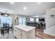 Modern kitchen with white cabinets, stainless steel appliances and an island at 12409 W Montebello Ave, Litchfield Park, AZ 85340