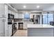 Modern kitchen featuring stainless steel appliances and an island at 12409 W Montebello Ave, Litchfield Park, AZ 85340