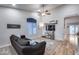 Bright and airy living room with a mounted TV and plenty of natural light at 12409 W Montebello Ave, Litchfield Park, AZ 85340