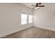 Well-lit bedroom featuring wood-look floors and neutral walls at 1245 W 1St St # 103, Tempe, AZ 85281