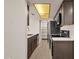 Modern kitchen with dark cabinets, stainless steel appliances, and quartz countertops at 1245 W 1St St # 103, Tempe, AZ 85281