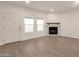 Living room with fireplace and wood-look floors at 1245 W 1St St # 103, Tempe, AZ 85281