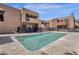 Community pool with surrounding patio and building views at 1245 W 1St St # 103, Tempe, AZ 85281