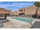 Inviting community pool with surrounding patio and building views at 1245 W 1St St # 103, Tempe, AZ 85281