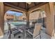 Poolside table with chairs under a covered patio at 1245 W 1St St # 103, Tempe, AZ 85281