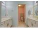 Bright bathroom with double vanity and separate toilet area at 13842 S 40Th St # 1004, Phoenix, AZ 85044