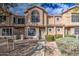 Front view of a two-story townhome with a paved walkway and landscaping at 13842 S 40Th St # 1004, Phoenix, AZ 85044