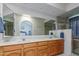 Double vanity bathroom with a large mirror and walk-in shower at 13872 N 89Th St, Scottsdale, AZ 85260