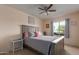 Bedroom with gray double bed, ceiling fan, and window coverings at 13872 N 89Th St, Scottsdale, AZ 85260