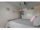 Bedroom with gray double bed, ceiling fan, and window coverings at 13872 N 89Th St, Scottsdale, AZ 85260