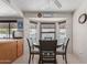 Bright dining area with a round table, four chairs, and pool view at 13872 N 89Th St, Scottsdale, AZ 85260