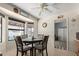 Cozy dining area with a round table, four chairs, and large windows at 13872 N 89Th St, Scottsdale, AZ 85260